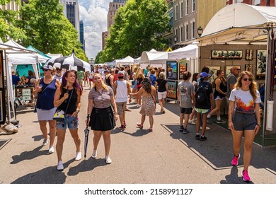 Raleigh, North Carolina USA-05 21 2022: A Large Crowd Of People Walk Down Fayetteville Street At Artsplosure Festival.