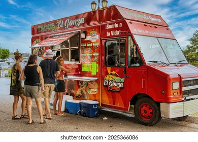 Raleigh, North Carolina USA-08 15 2021: Several People Enjoy A Meal At A Mexican Food Truck On A Sunday.