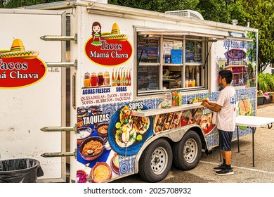 Raleigh, North Carolina USA-08 15 2021: A Young Hispanic Man Orders Some Food At A Popular Taco Truck.