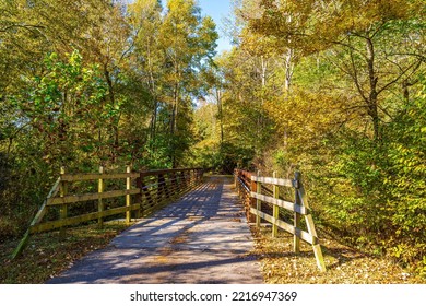 Raleigh, North Carolina USA-10 20 2022: A Pedestrian Bridge On The Neuse River Trail In Autumn.