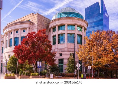 Raleigh, North Carolina USA-11 25 2021: The North Carolina State Natural Sciences Museum With The State Employees Credit Union Building In The Background.