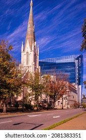 Raleigh, North Carolina USA-11 25 2021: First Baptist Church Of Raleigh With The State Employees Credit Union Building In The Background.