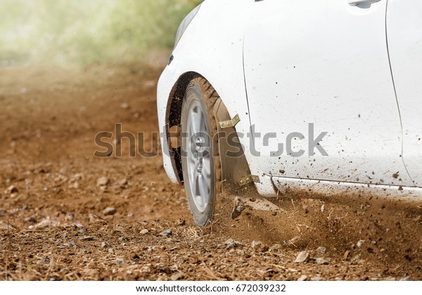 Rally Car in dirt\
track