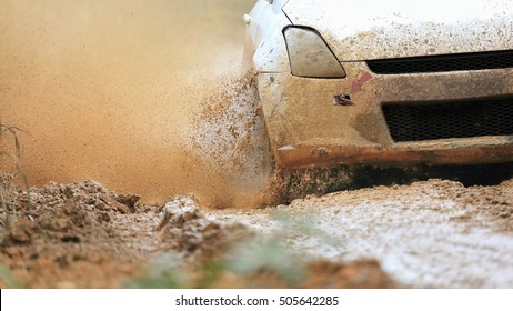 Rally Car In Muddy Road