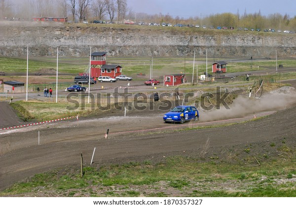 Rally car\
racing on a race track in an old\
quarry