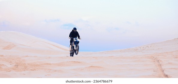 Rally, desert or athlete driving motorcycle for action, adventure or fitness with performance or adrenaline. Sand, sports or person on motorbike on dunes for training, exercise or race or challenge - Shutterstock ID 2364786679
