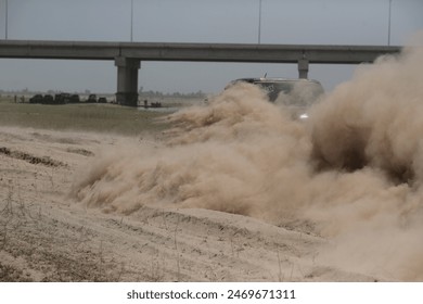 Rally race car drifting on dirt track.
