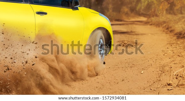 Rally racing car on dirt\
track.