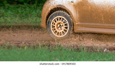 Rally Racing Car On Muddy Track.