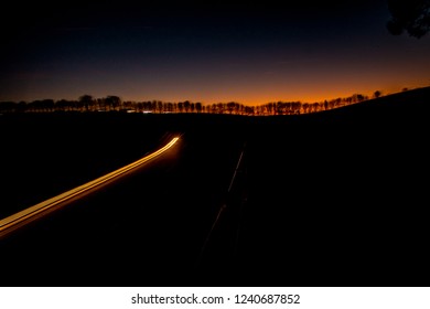 A Rally Undertaken On A Racetrack, Carried Out At Night / Dusk.