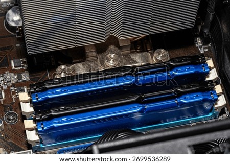 RAM modules plugged into DIMM slots on the motherboard in a dual channel system.
