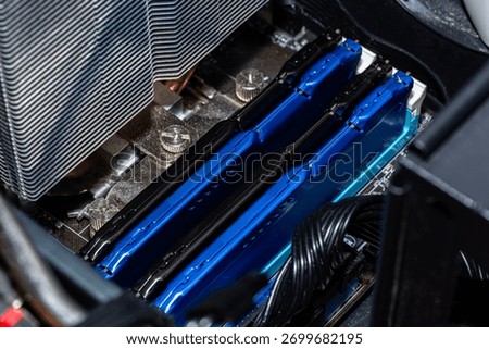 RAM modules plugged into DIMM slots on the motherboard in a dual channel system.