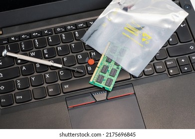 RAM is upgraded and placed in ESD packaging on a PC keyboard - The packaging protects sensitive electronic components from electrostatic discharge