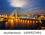 Rama VIII bridge in Bangkok at twilight. Thailand beautiful bridge across the Chao Phraya river with fantastic sky.
