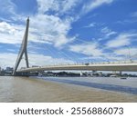 The Rama VIII Bridge is a cable-stayed bridge crossing the Chao Phraya River in Bangkok, Thailand. The Rama VIII Bridge with cloudy sky.