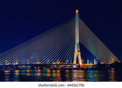 Rama VIII Bridge at night in Bangkok and Chao Phraya river, Thailand