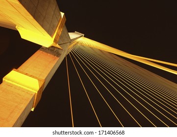 The Rama VIII bridge over the Chao Praya river at night in Bangkok, Thailand