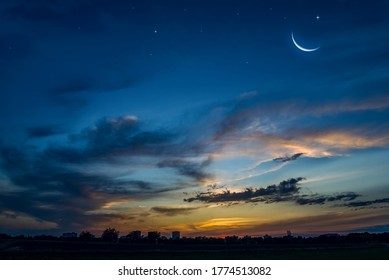 Ramadan background with a crescent and sunset sky . beautiful dawn in the morning