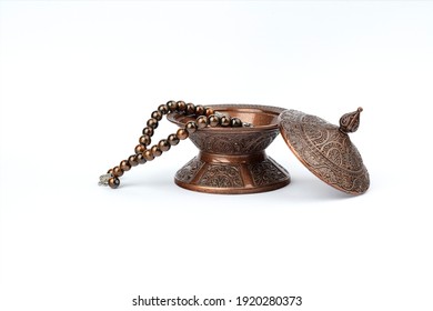 Ramadan concept with prayer beads and plate.
