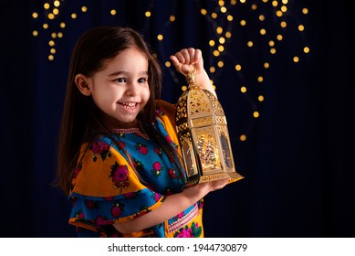 Ramadan Girl Holding A Golden Lantern