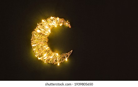 Ramadan Glowing Crescent On Green Background