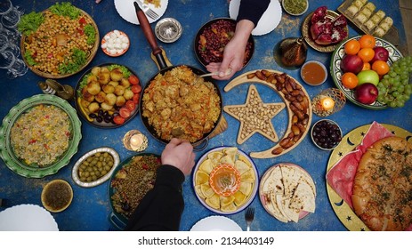 Ramadan Iftar Eid. Muslim Family Has Dinner At Home. Table With Traditional Food. Eid Al-Fitr Celebrations