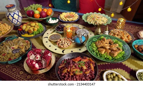 Ramadan Iftars Marks The End Of Fasting. Table With Dates, Oriental Food And Sweets. Eid Mubarak. Traditional Middle Eastern Cuisine, Evening Meal