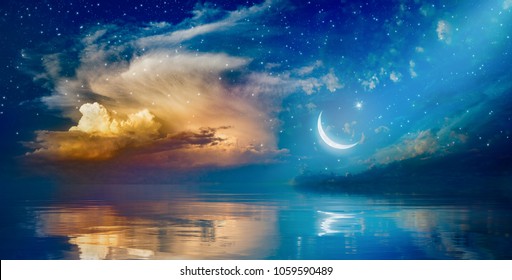 Ramadan Kareem background with crescent, stars and glowing clouds above serene sea.  Elements of this image furnished by NASA