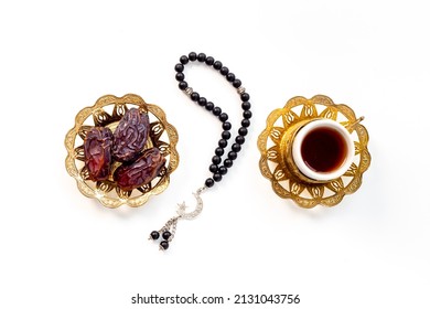 Ramadan Kareem background. Islamic rosary and dates fruits with tea