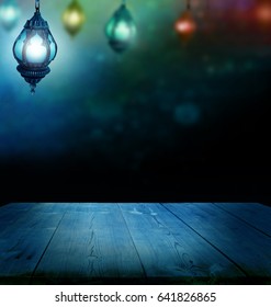 Ramadan Kareem background.Ramadan lantern and wooden  table