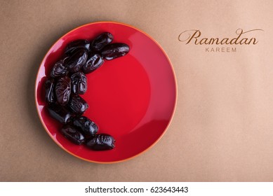 Ramadan Kareem With Dates Arranged In Shape Of Crescent Moon