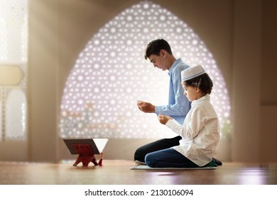 Ramadan Kareem Greeting. Father And Son In Mosque. Muslim Family Praying. Man And Child Read Quran And Pray. End Of Fasting. Hari Raya Day. Eid Al-Fitr Celebration. Breaking Of Holy Fast Day. 