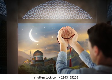 Ramadan Kareem Greeting. Man With Prayer Beads In Mosque. Muslim Male Praying. Quran Reading And Pray. End Of Fasting. Hari Raya Day. Eid Al-Fitr Celebration. Breaking Of Holy Fast Day. 