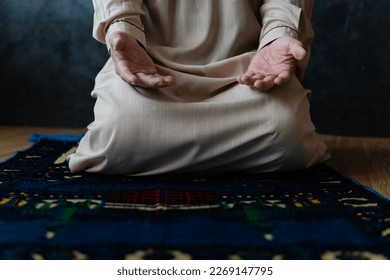 ramadan kareem greetings. Man with prayer beads in mosque. Muslim male praying. Quran reading and praying. End of fasting. Hari Raya day. Eid al-Fitr celebration. Breaking of holy fast day. - Powered by Shutterstock