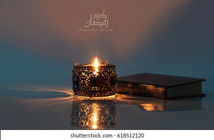 Ramadan Kareem With Holy Quran And Lantern Lit
