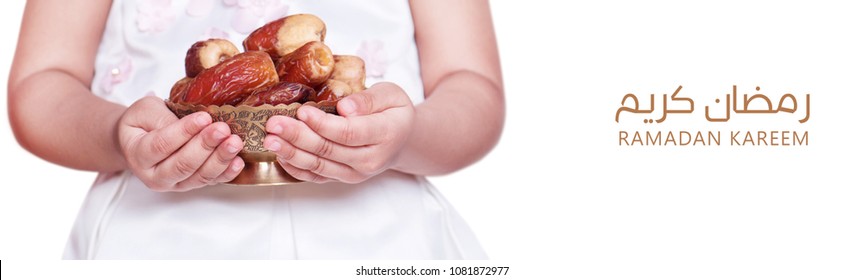 Ramadan Kareem Meaning Blessed Ramadan With Two Year Old Muslim Baby Girl Holding Bowl Of Dates Fruit