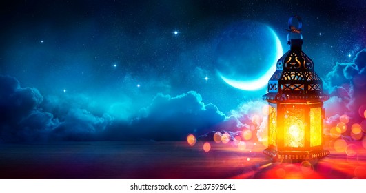Ramadan Kareem - Moon And Arabian Lantern With Blue Sky At Night With Abstract Defocused Lights - Eid Ul Fitr - Shutterstock ID 2137595041