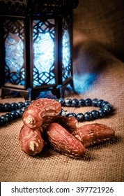 Ramadan lantern, dates and rosary still life. Traditional Egyptian Ramadan lamp with dates.