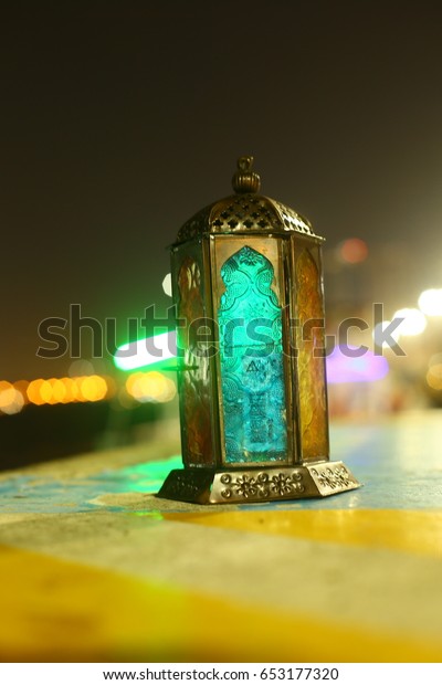 ramadan lantern\
with dubai city blur\
background