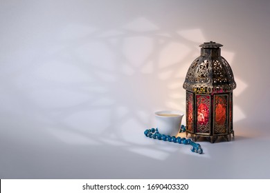 Ramadan Lantern, Rosary Beads And Arabic Coffee, With Arabesque Shadow On Background.