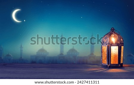 Ramadan lantern shines at night. Islamic greeting Eid Mubarak cards for Muslim Holidays.Eid-Ul-Adha festival celebration.Arabic. Crescent moon and the stars. 
