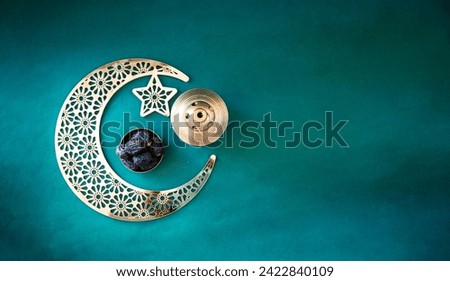 Ramadan Mubarak background 2024, Banner type image of crescent moon shape with dates isolated on dark green colour background with copy space
