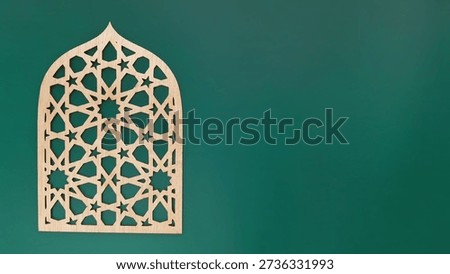 Ramadan pattern background, Intricately designed wooden panel featuring geometric and star patterns, mounted on a green background. The panel is shaped like an arched window, commonly associated with Islamic architecture, evoking elements of traditional Middle Eastern design. The combination of light wood and soft pink adds a harmonious and serene ambiance, suitable for a Ramadan-themed decor.