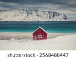 Ramberg Red Hut and nordic sea, Lofoten Islands, winter seascape Norway. 