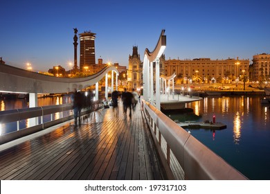 Rambla de Mar wooden walkway over Port Vell in the city of Barcelona at night in Catalonia, Spain. - Powered by Shutterstock
