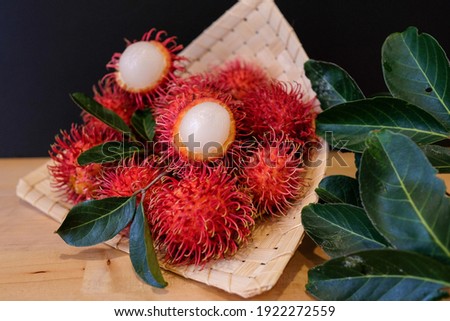 Rambutan or hairy fruit is a tropical fruit. A close up look on ripe rambutan. Selective focus
