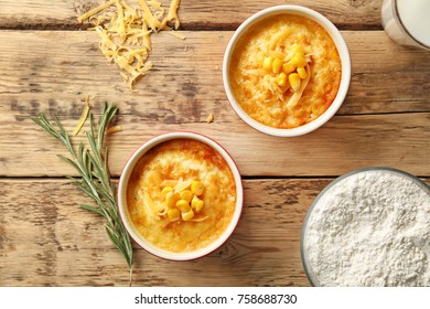 Ramekins With Corn Pudding On Table