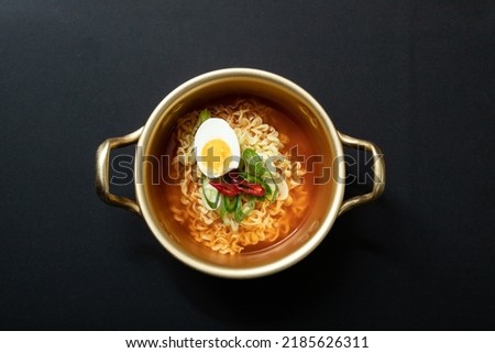 Ramen in a nickel-silver pot with boiled eggs. Ramen, which originated in Japan, was transformed into a Korean style and developed into an instant food.