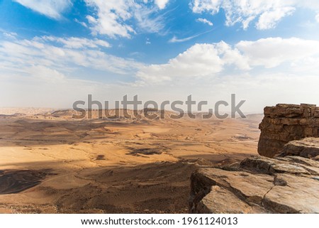 Ramon Crater Makhtesh Ramon, the largest in the world, as seen from the high rocky cliff edge surrounding it from the north, Ramon Nature reserve, Mitzpe Ramon, Negev desert, Israel High quality photo