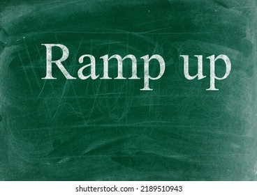 Ramp Up Business Phrase Written In Chalk On A Blackboard